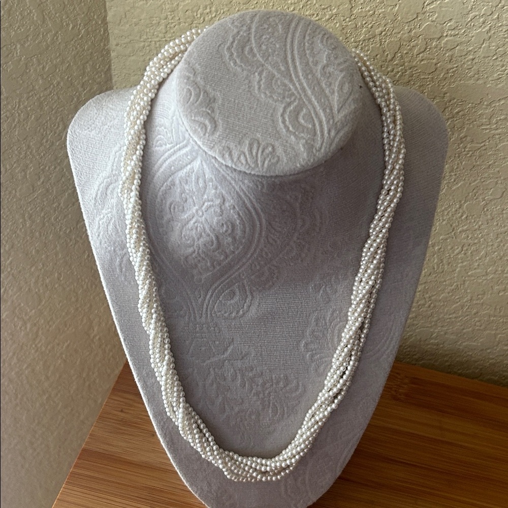 Twisted faux pearl multi-strand necklace.